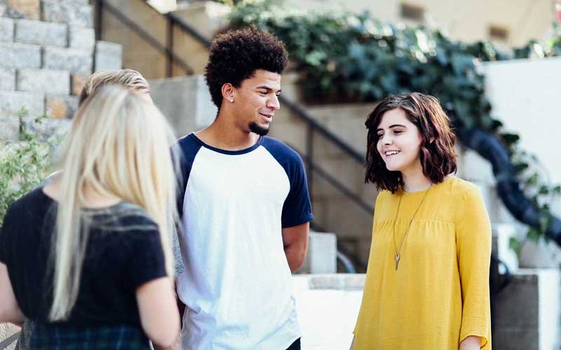 student using microscope in science